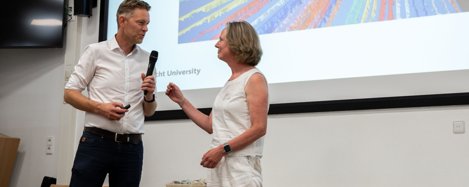 Presentatie van kartrekkers Jeanine Verbunt en Ivan Huijnen tijdens symposium 10 jaar Academische Werkplaats Revalidatie